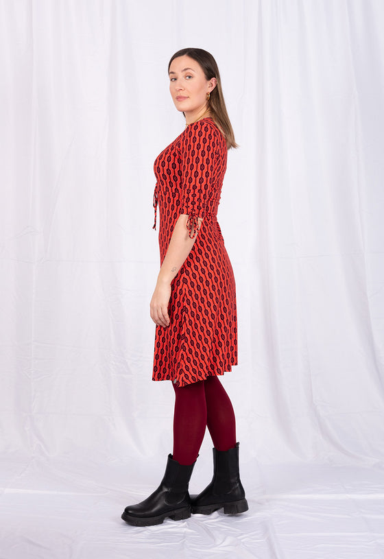 Kleid mit V-Ausschnitt, halblangen Ärmeln und Zierbändern - VD01W23